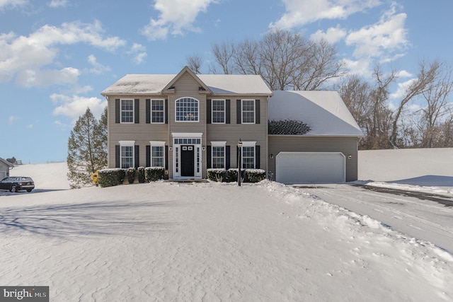 colonial inspired home featuring a garage