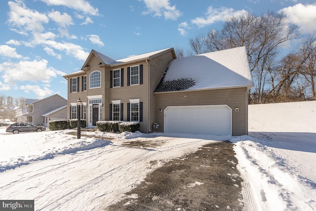 colonial inspired home with a garage