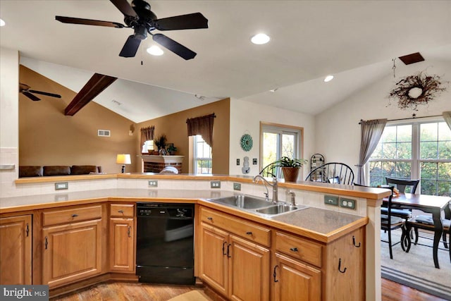 kitchen with sink, black dishwasher, kitchen peninsula, light hardwood / wood-style floors, and vaulted ceiling