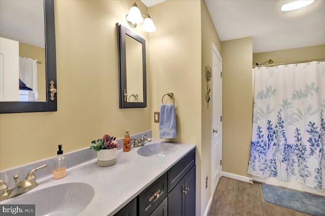 bathroom featuring a shower with curtain, vanity, and hardwood / wood-style flooring