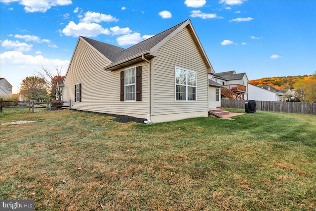 view of property exterior with a lawn