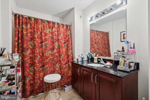 bathroom featuring tile patterned floors and vanity