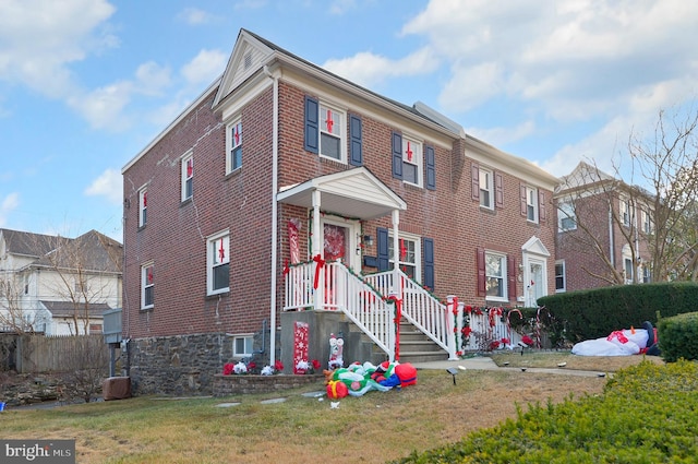 view of property featuring a front yard