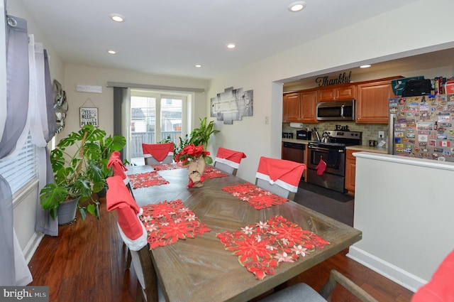 dining area featuring dark wood-type flooring