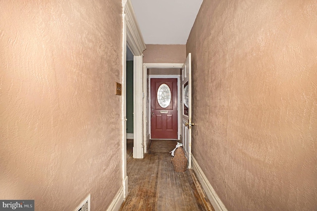 doorway featuring dark wood-type flooring