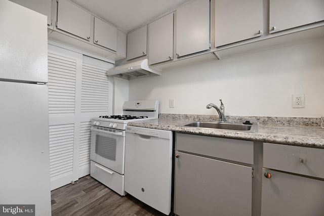 kitchen featuring sink, white appliances, and dark wood-type flooring