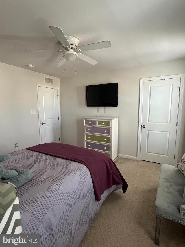 carpeted bedroom with ceiling fan