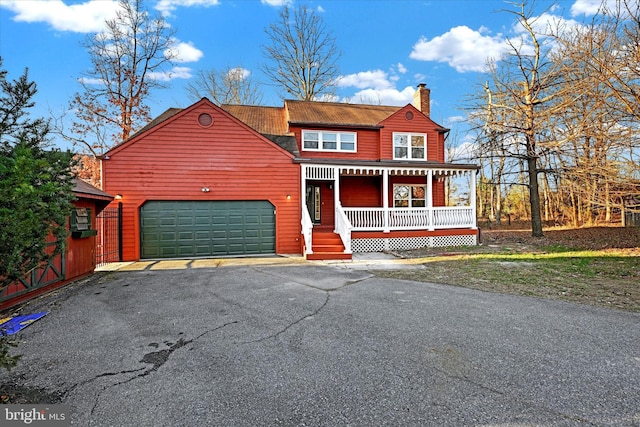 view of front of house with covered porch and a garage