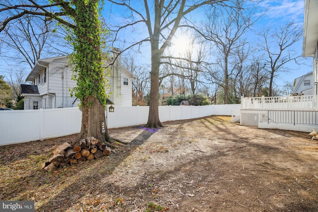 view of yard featuring a wooden deck