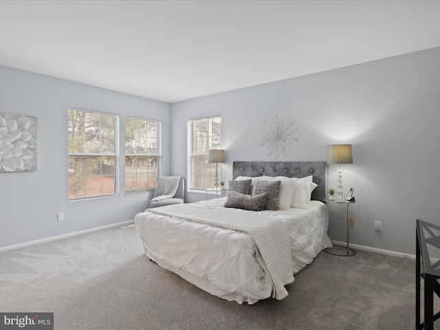 bedroom featuring dark carpet