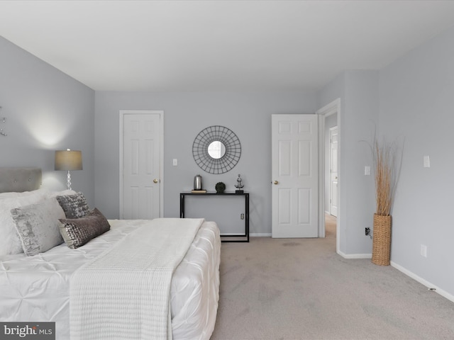 bedroom featuring light carpet