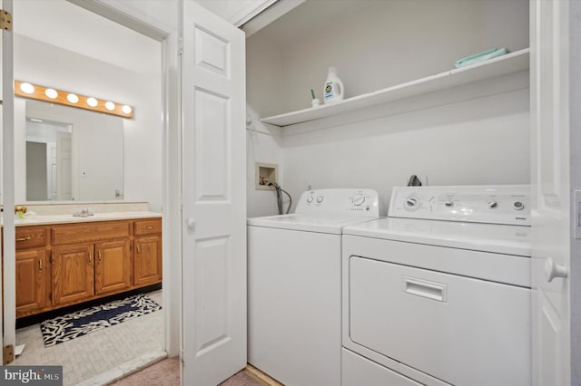 clothes washing area featuring separate washer and dryer