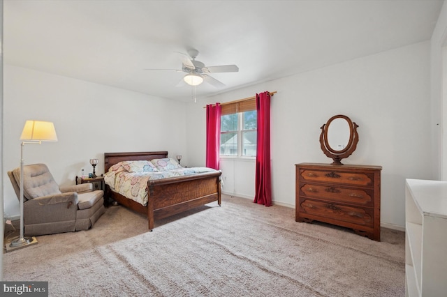 bedroom with ceiling fan and light colored carpet