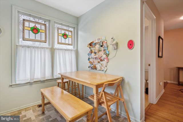 dining area featuring light wood-type flooring