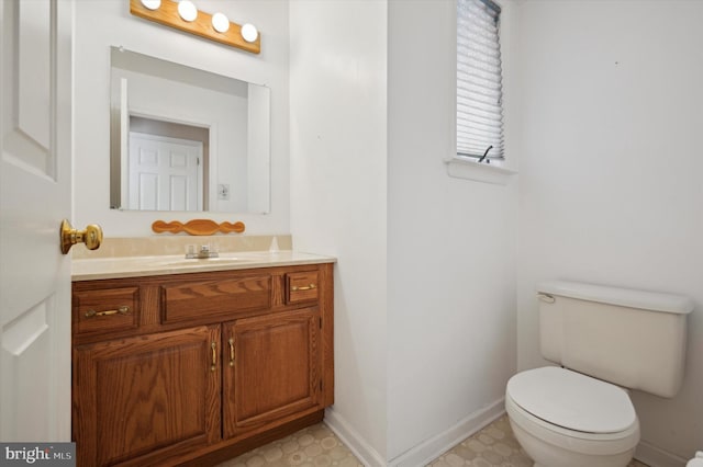 bathroom with toilet and vanity