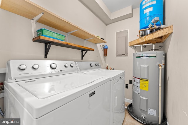 laundry area featuring electric panel, washer and clothes dryer, and water heater