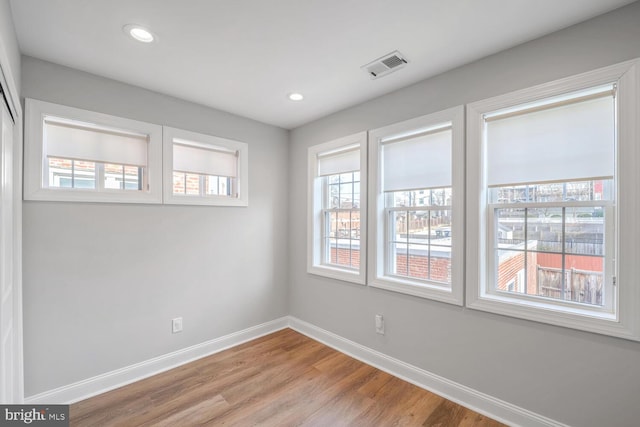 spare room featuring light hardwood / wood-style flooring