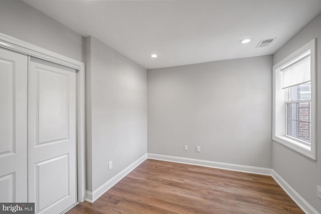 interior space with a closet and light hardwood / wood-style floors