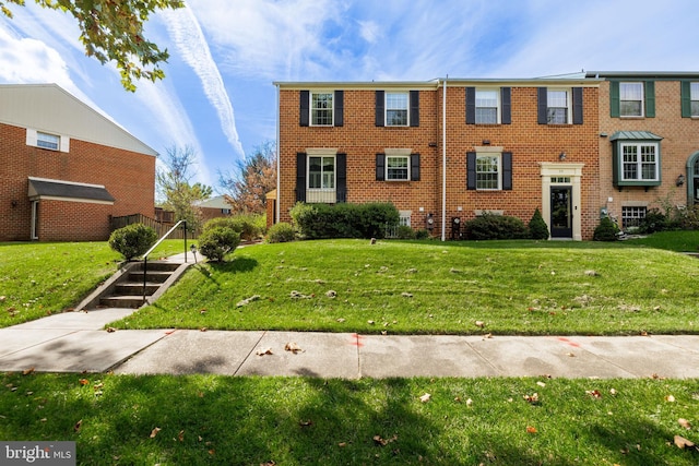 view of front of home with a front yard