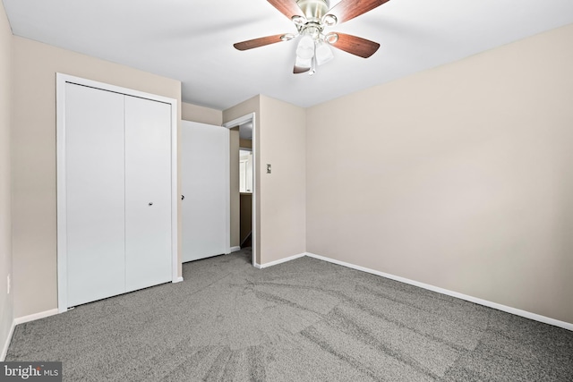 unfurnished bedroom with carpet floors, a closet, and ceiling fan