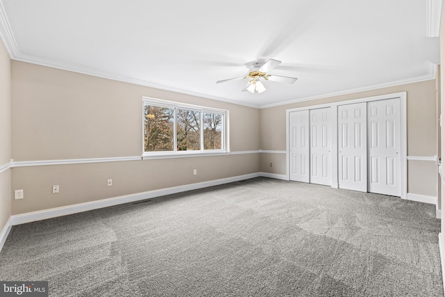 unfurnished bedroom with ceiling fan, carpet, and ornamental molding