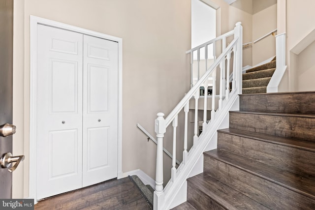 stairs with wood-type flooring