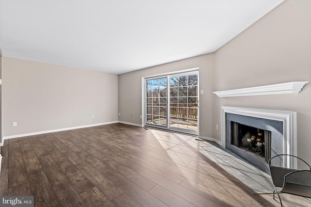 unfurnished living room with hardwood / wood-style floors