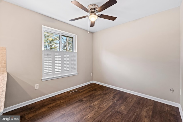 empty room featuring hardwood / wood-style floors and ceiling fan