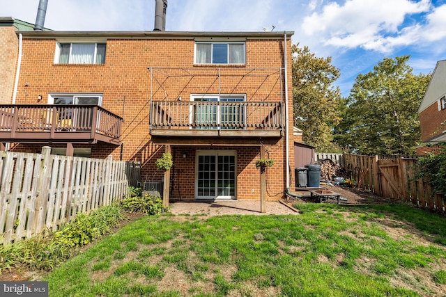 back of property featuring central AC unit and a lawn