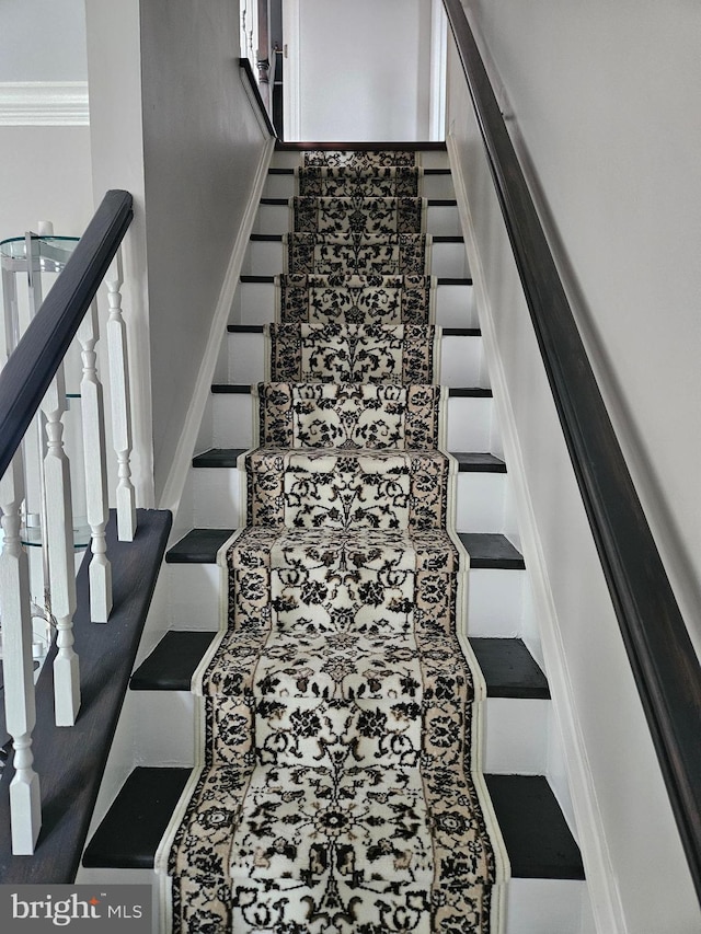 stairway with crown molding