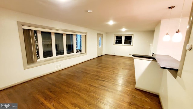 unfurnished room featuring dark hardwood / wood-style flooring