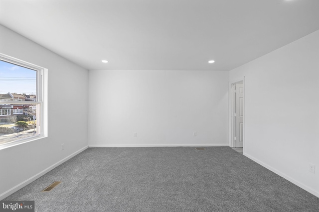 spare room featuring carpet floors