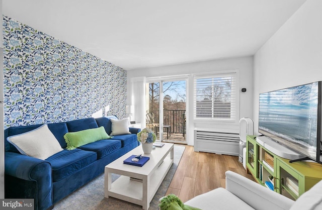 living room with light hardwood / wood-style flooring