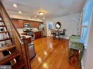 kitchen featuring stainless steel appliances and light wood-type flooring