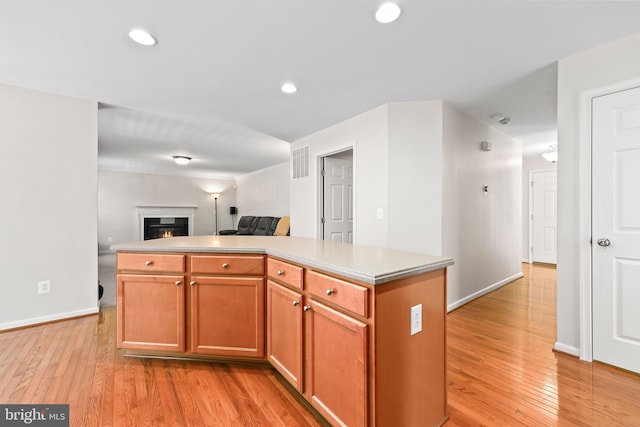 kitchen featuring light hardwood / wood-style floors and a kitchen island