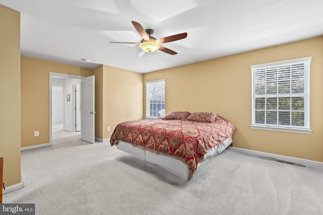 bedroom with light colored carpet and ceiling fan