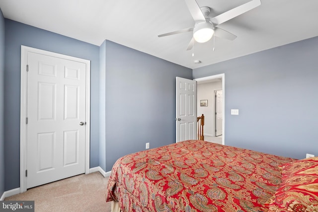 bedroom with light carpet and ceiling fan