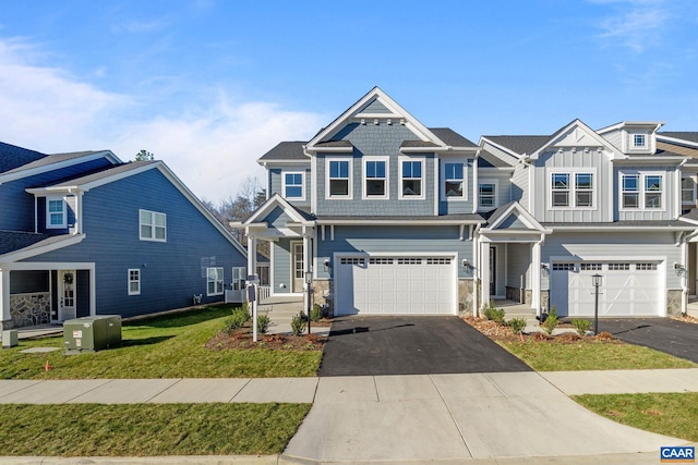 view of front facade featuring a garage and a front lawn