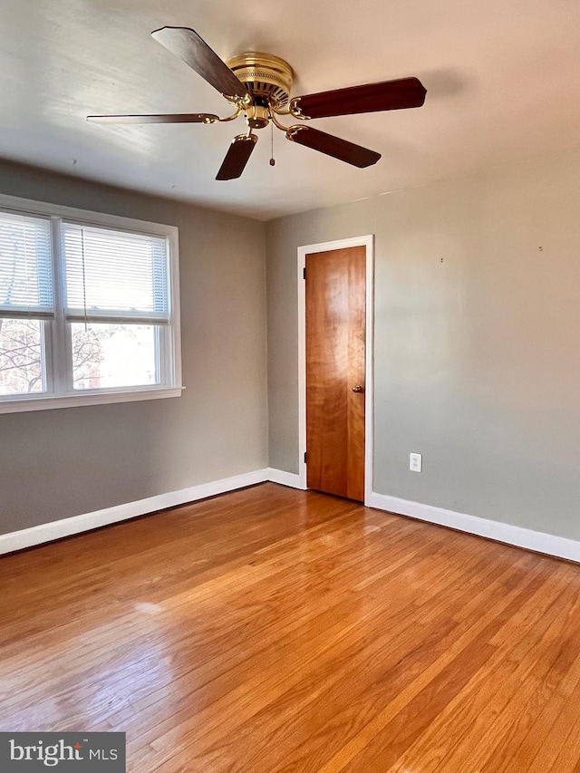 unfurnished room featuring ceiling fan and light hardwood / wood-style floors