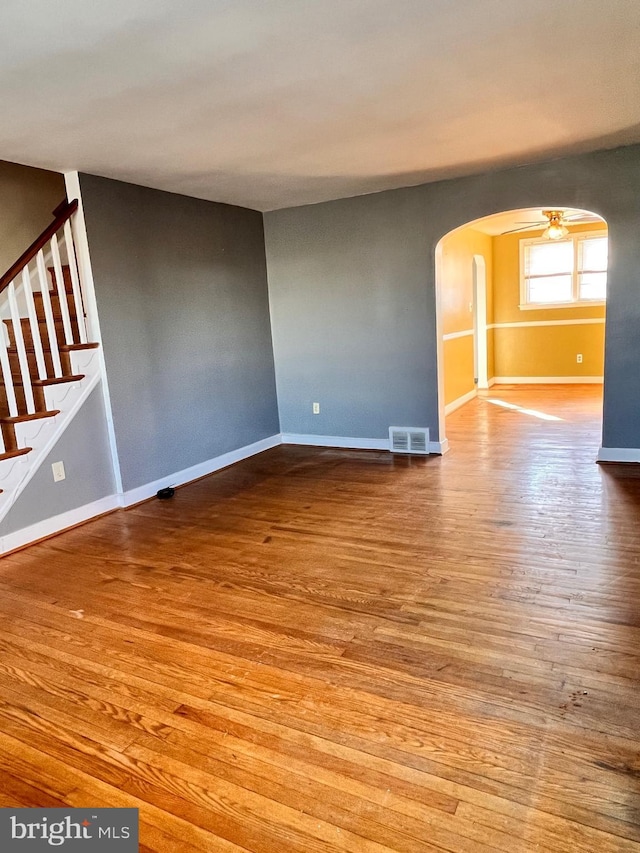 spare room with ceiling fan and light hardwood / wood-style floors