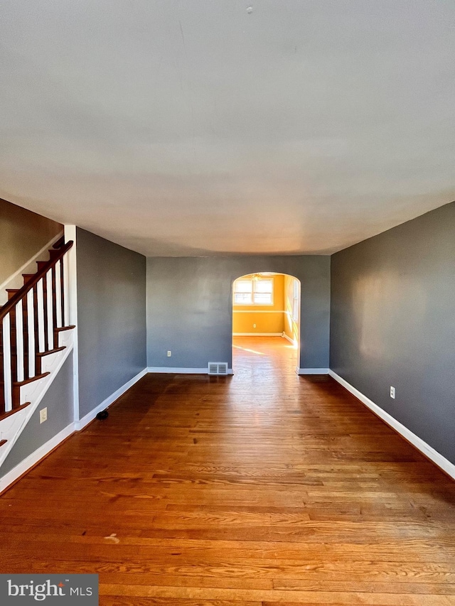 unfurnished room with light wood-type flooring