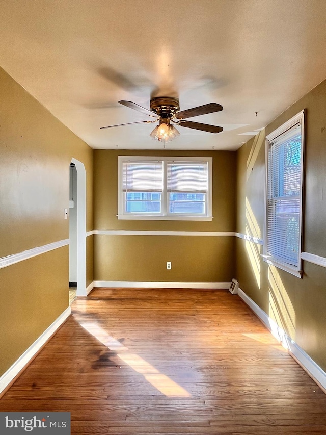 spare room featuring ceiling fan and light hardwood / wood-style flooring