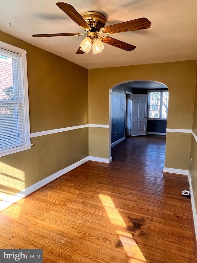 unfurnished room featuring ceiling fan and hardwood / wood-style floors