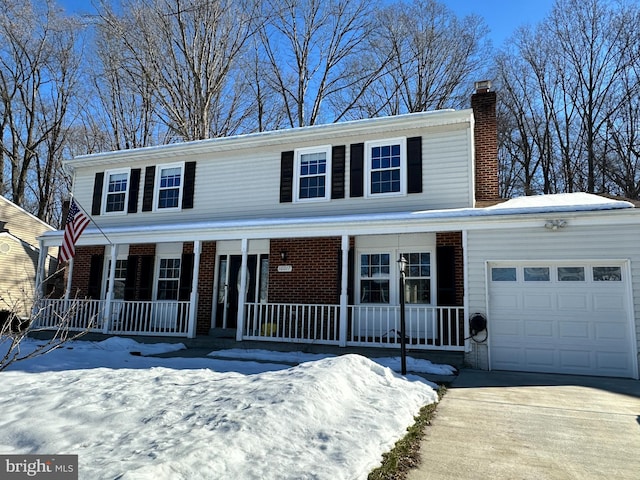 view of front of property with a porch and a garage