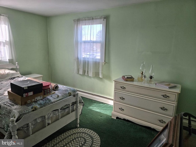 carpeted bedroom featuring a baseboard radiator