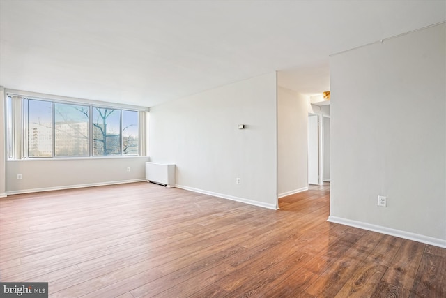 spare room featuring light wood-type flooring