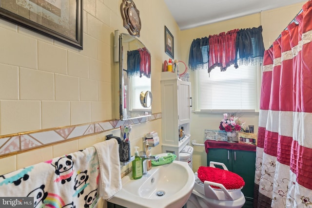 bathroom with a healthy amount of sunlight and sink