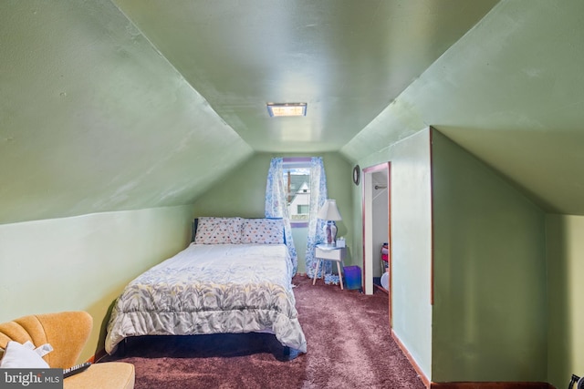 carpeted bedroom featuring vaulted ceiling