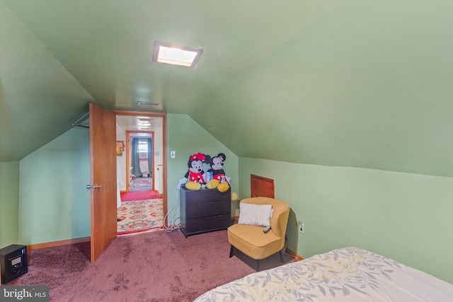 carpeted bedroom with lofted ceiling