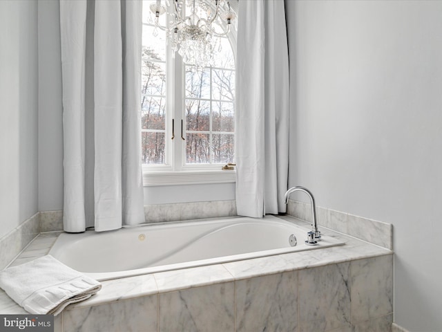 bathroom with a relaxing tiled tub